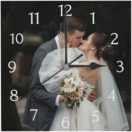 Wedding couple kissing with a clock face overlay